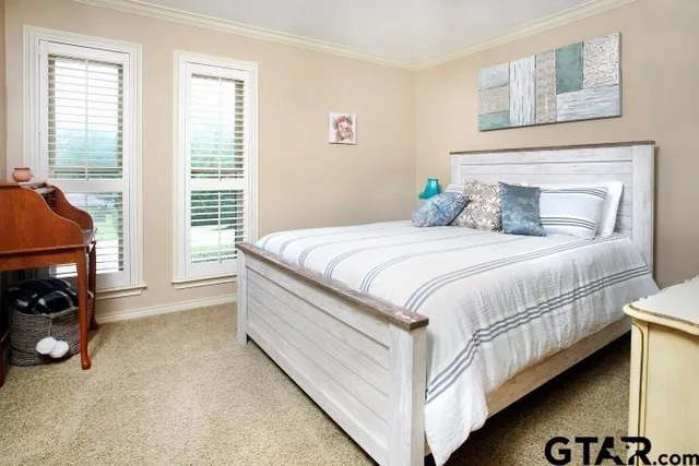 a bedroom with a bed and a tv