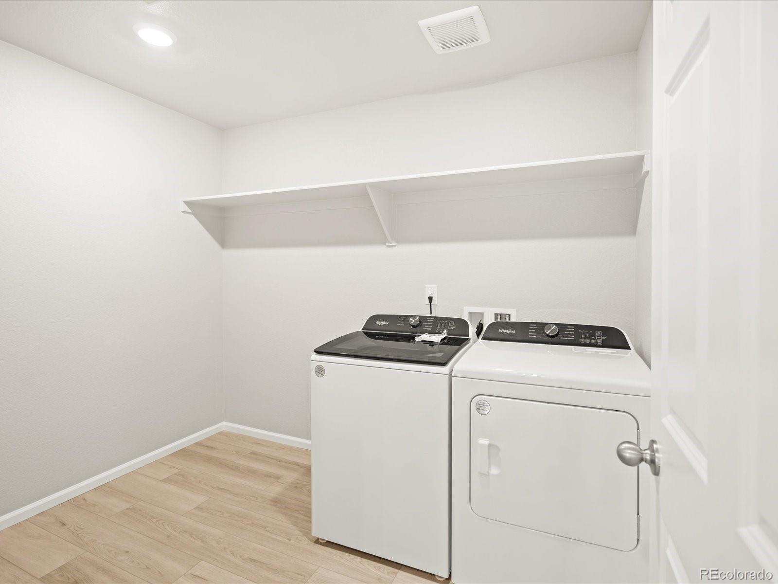 17517 East 89th Way Commerce City, CO 80022 - Photo 15 of 31 a utility room with dryer and washer