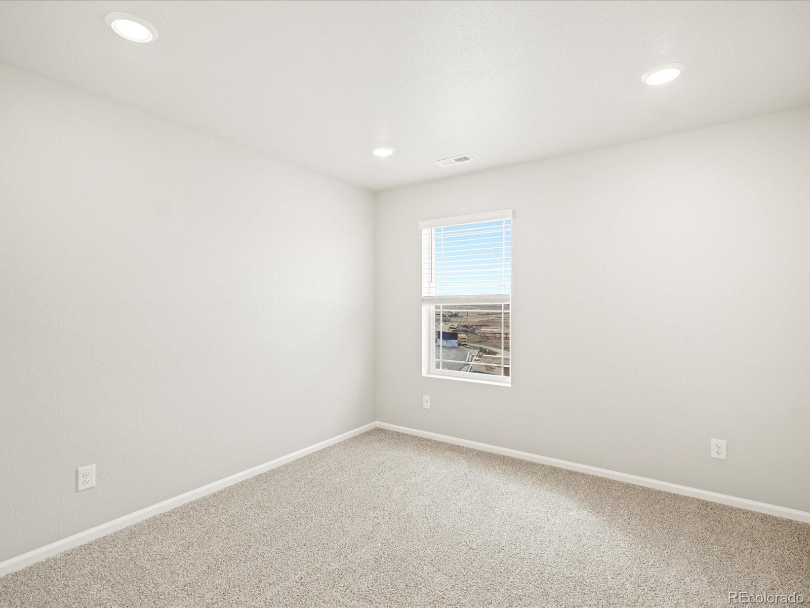 17517 East 89th Way Commerce City, CO 80022 - Photo 16 of 31 an empty room with a window