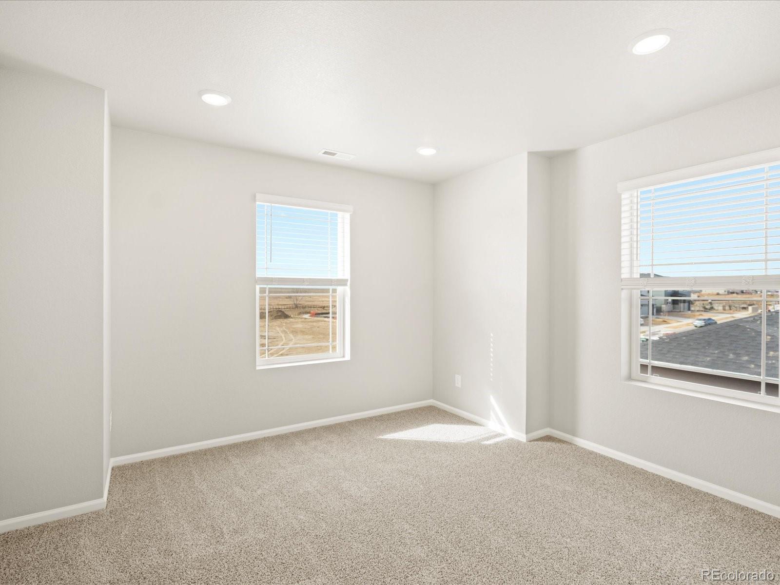 17517 East 89th Way Commerce City, CO 80022 - Photo 18 of 31 a view of an empty room with a window