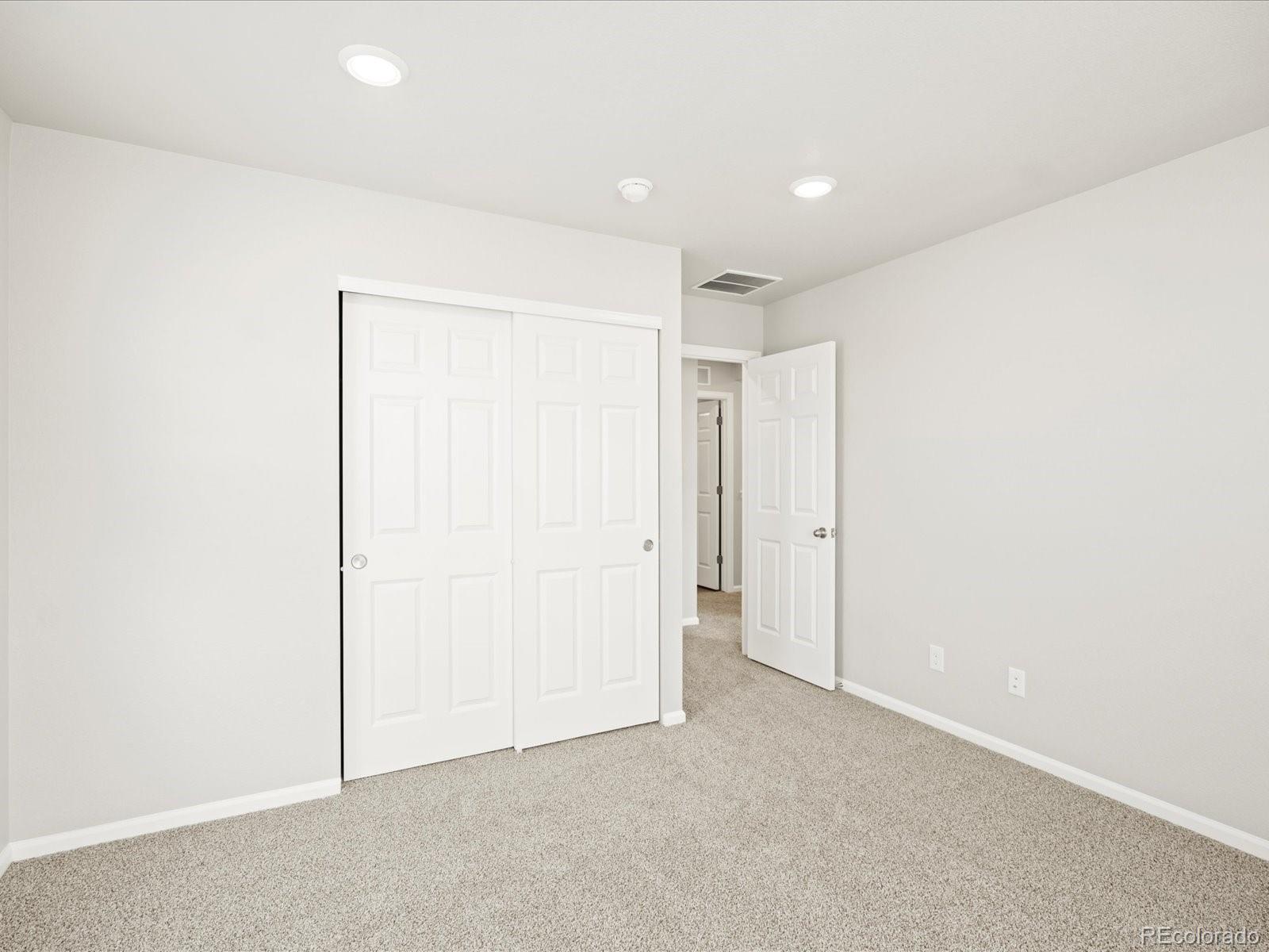 17517 East 89th Way Commerce City, CO 80022 - Photo 19 of 31 a view of an empty room