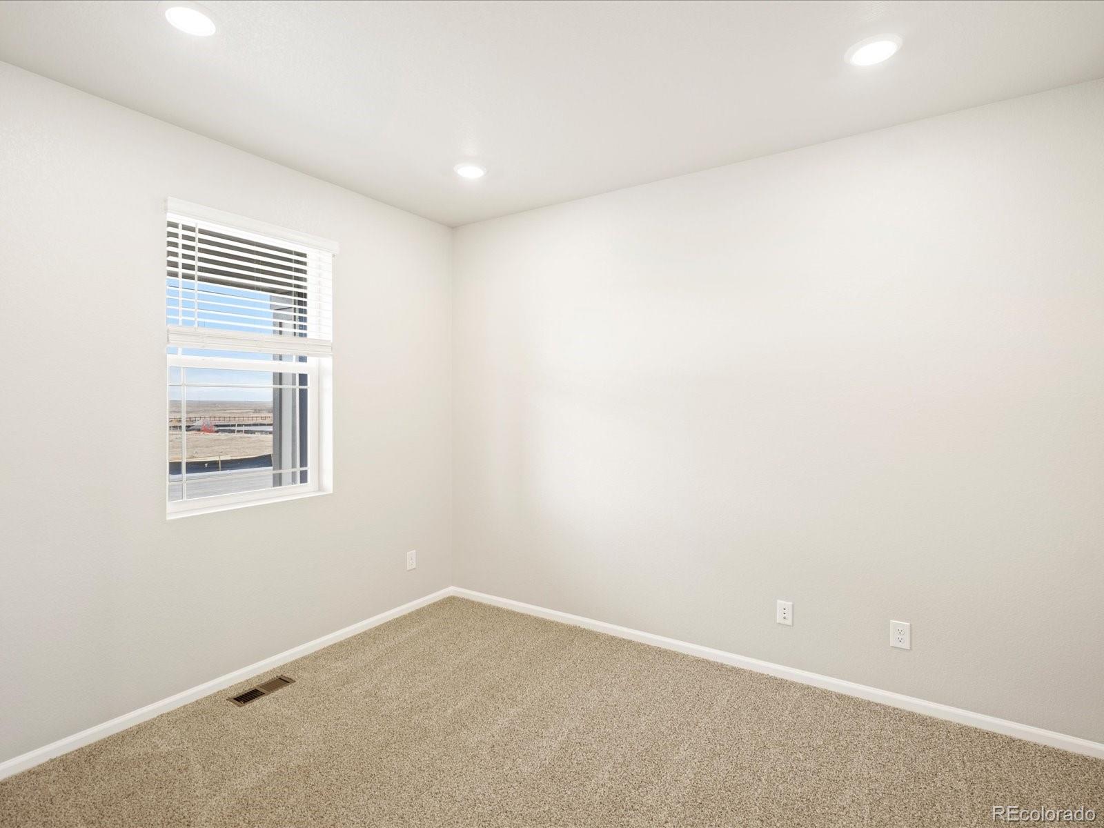 17517 East 89th Way Commerce City, CO 80022 - Photo 2 of 31 an empty room with a window
