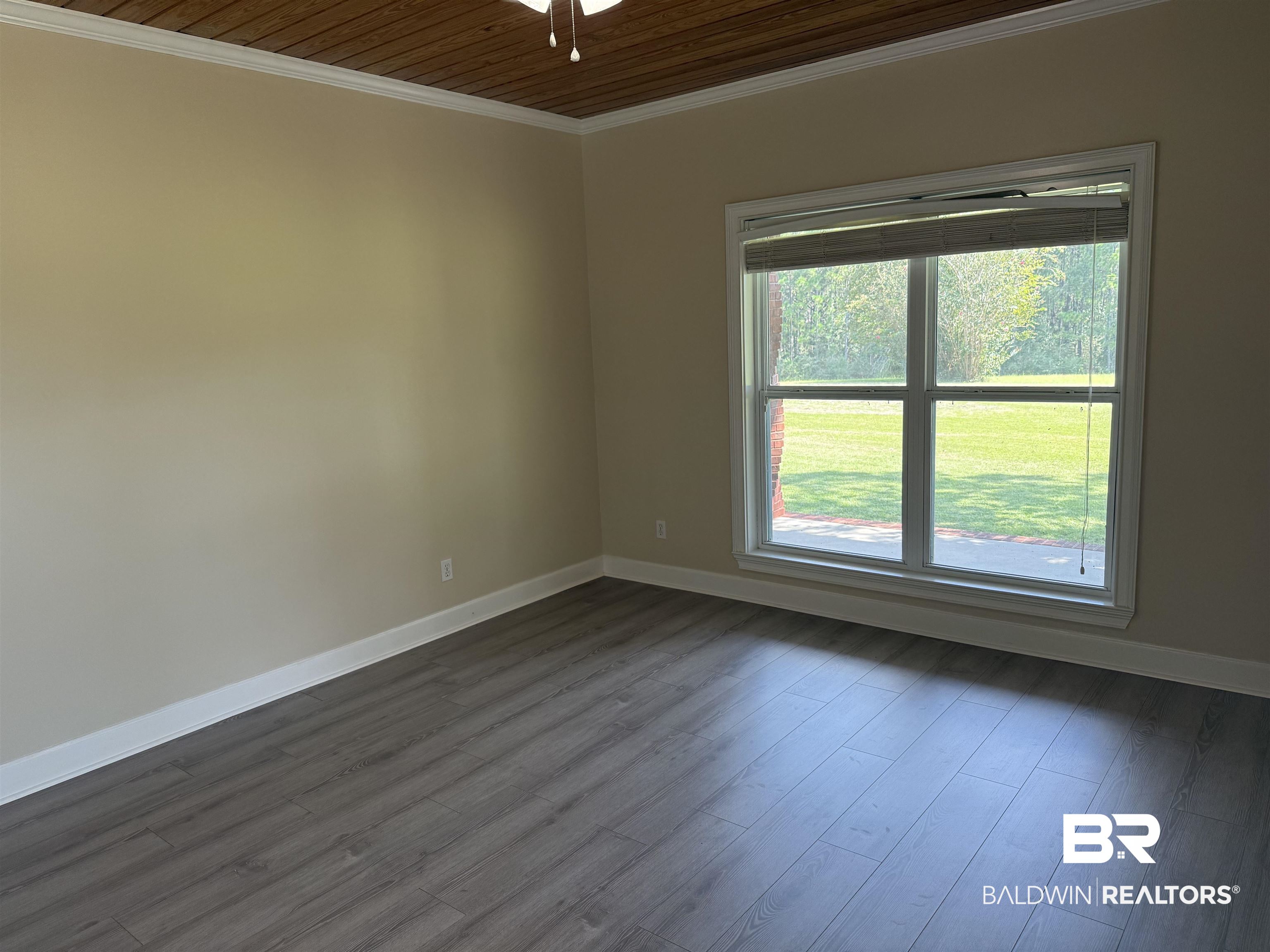 415 Juniper Creek Road Brewton, AL 36426 - Photo 12 of 35 Spare room featuring ornamental molding, dark wood finished floors, and wooden ceiling