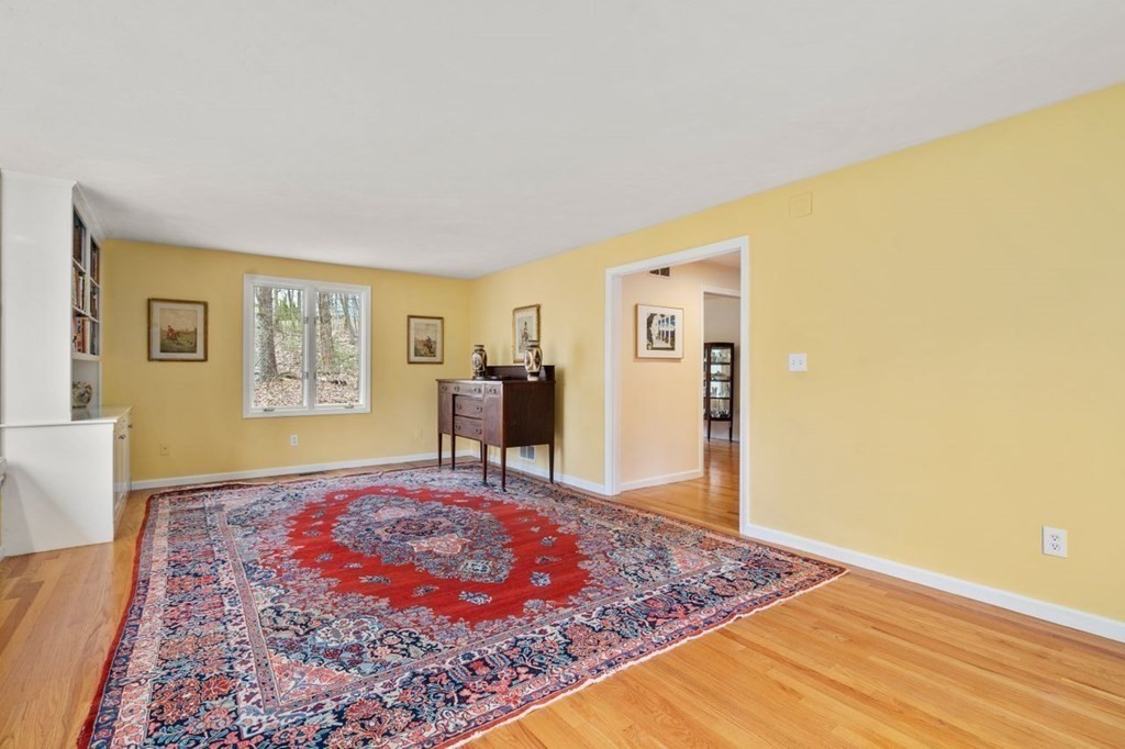 24 Parmenter Road Framingham, MA 01701 - Photo 23 of 42 a view of an empty room with window and wooden floor