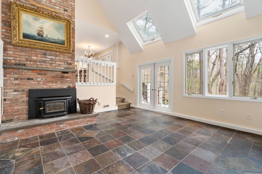 24 Parmenter Road Framingham, MA 01701 - Photo 28 of 42 a view of an empty room with a fireplace and a window