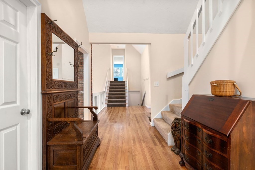24 Parmenter Road Framingham, MA 01701 - Photo 30 of 42 a view of a hallway with wooden floor and staircase