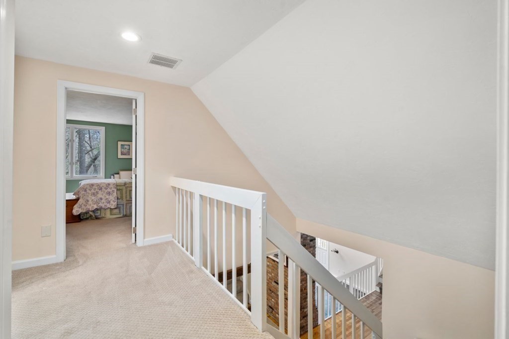 24 Parmenter Road Framingham, MA 01701 - Photo 32 of 42 a view of a hallway with a livingroom and a way to other room