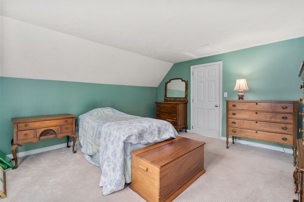 24 Parmenter Road Framingham, MA 01701 - Photo 35 of 42 a bedroom with a bed and a dresser