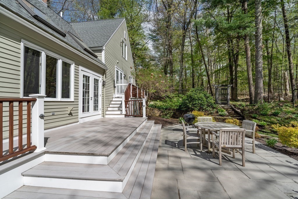 24 Parmenter Road Framingham, MA 01701 - Photo 8 of 42 a view of a patio with table and chairs and potted plants