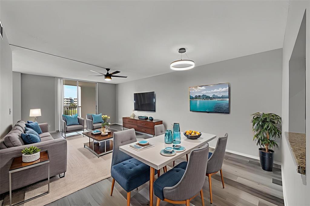 a living room with furniture potted plant and a window