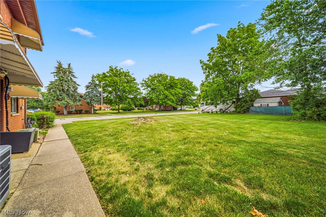1694 Ridgewick Drive Wickliffe, OH 44092 - Photo 29 of 30 Expansive green lawn with mature trees and concrete walkway