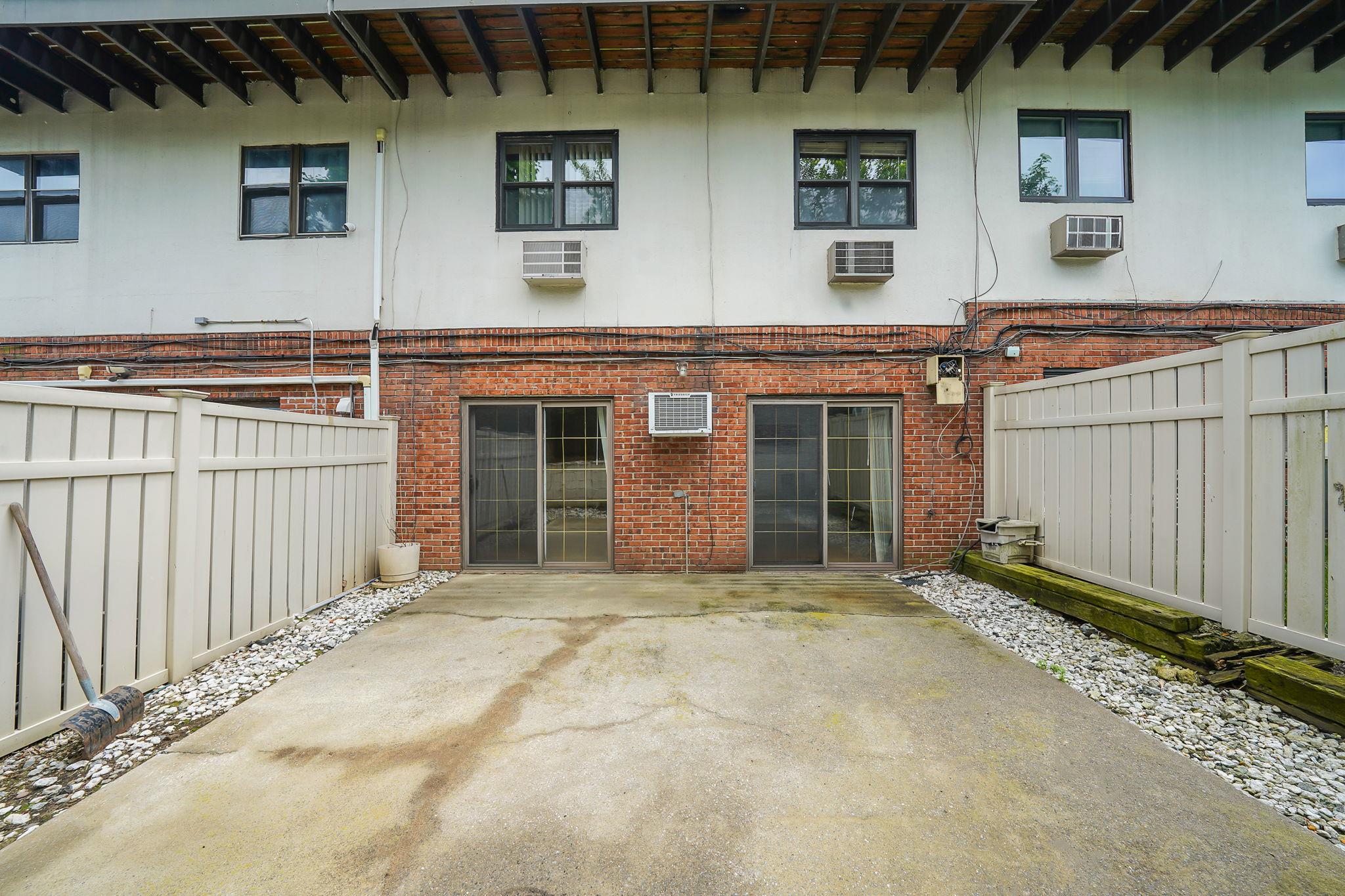 504 Julius Road, Unit 7C Queens, NY 11356 - Photo 2 of 22 a view of a house with a garage and window