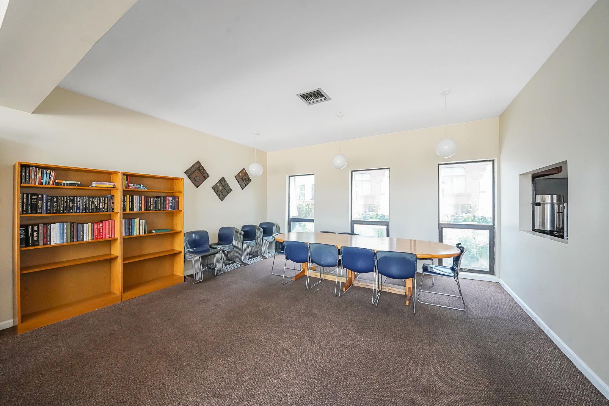504 Julius Road, Unit 7C Queens, NY 11356 - Photo 21 of 22 a living room with furniture and a window