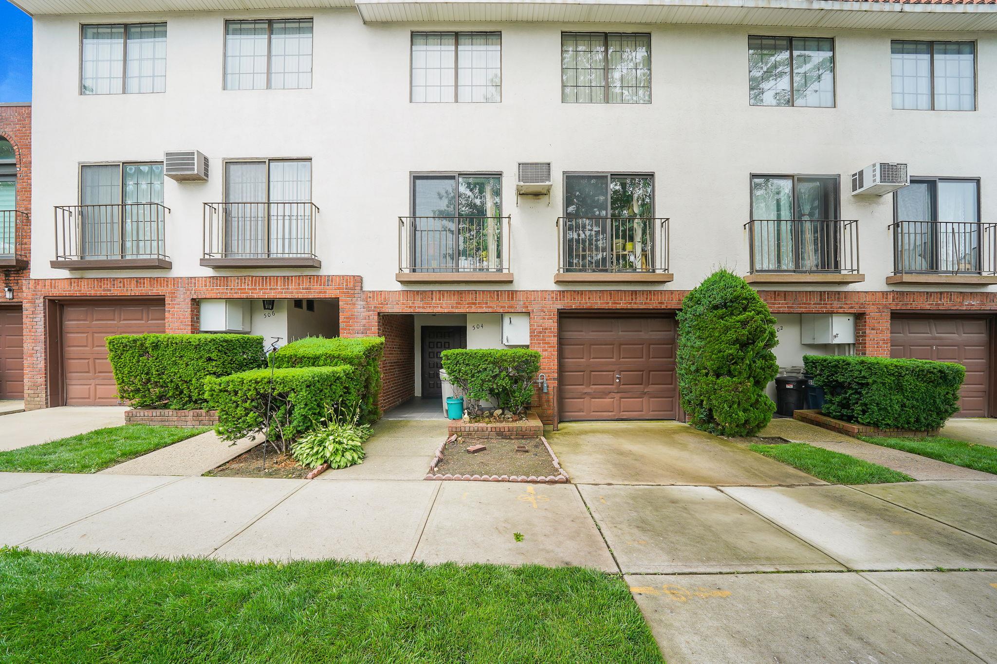 504 Julius Road, Unit 7C Queens, NY 11356 - Photo 22 of 22 a front view of a house with garden