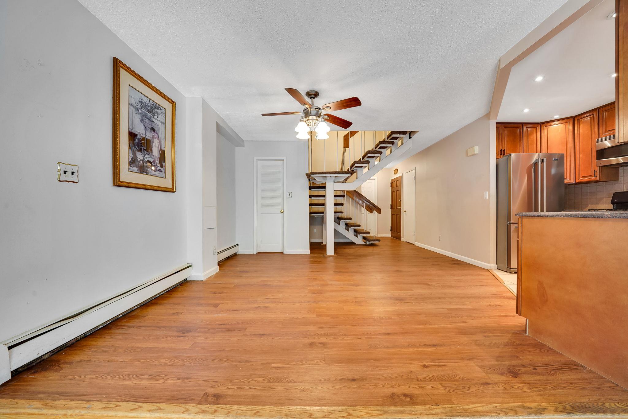 504 Julius Road, Unit 7C Queens, NY 11356 - Photo 5 of 22 a view of an empty room with stairs