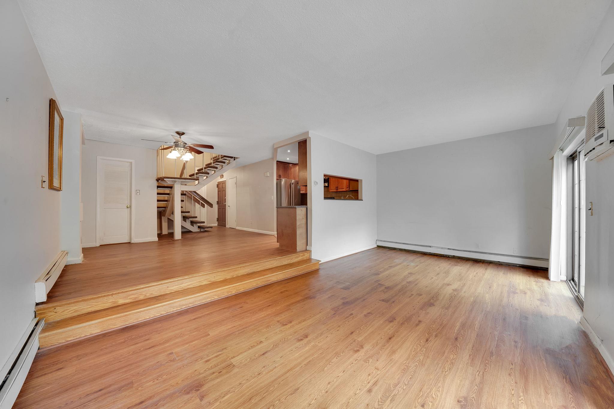 504 Julius Road, Unit 7C Queens, NY 11356 - Photo 9 of 22 a view of a livingroom with wooden floor