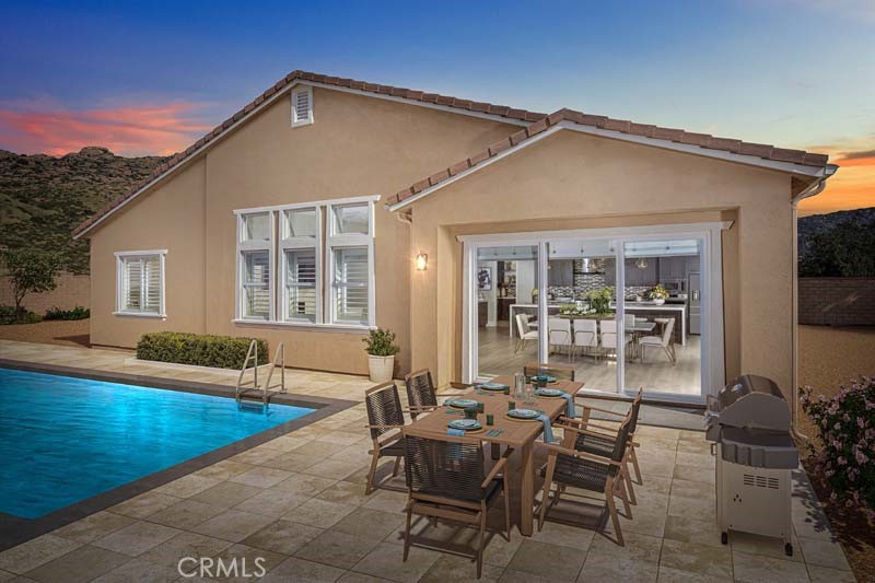 6505 Canyon Oaks Drive Simi Valley, CA 93063 - Photo 2 of 22 a view of a house with swimming pool and sitting area
