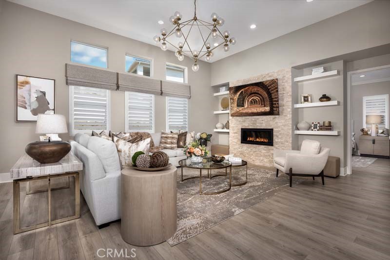 6505 Canyon Oaks Drive Simi Valley, CA 93063 - Photo 4 of 22 a living room with fireplace furniture and a chandelier