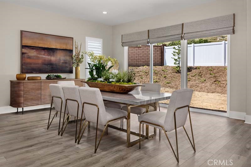 6505 Canyon Oaks Drive Simi Valley, CA 93063 - Photo 5 of 22 a dining room with furniture window and wooden floor