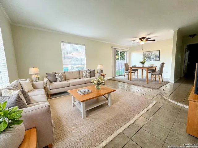a living room with furniture and a table