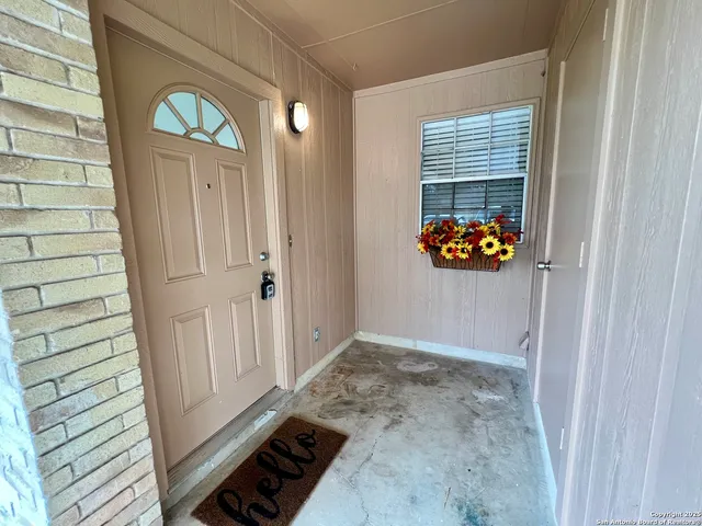 a kitchen with a stove sink and cabinets