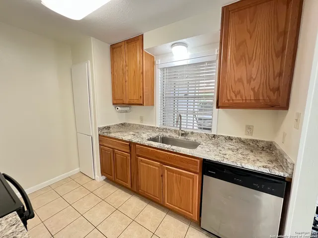 a kitchen with a stove and a microwave
