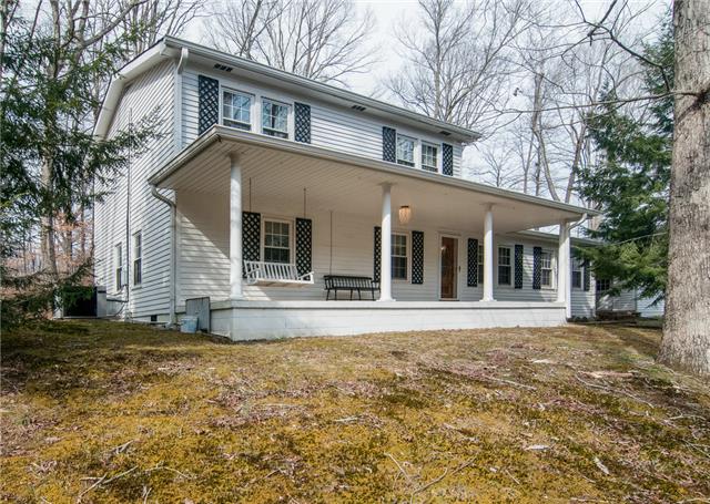 7720 Caney Fork Road Fairview, TN 37062 - Photo 1 of 20 a front view of a house with a yard