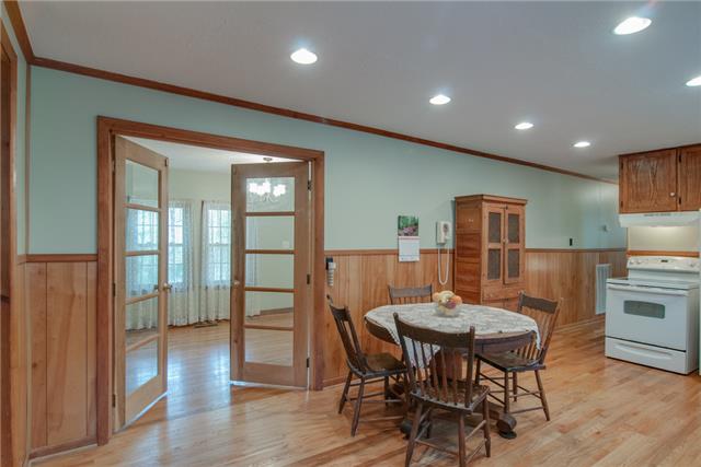 7720 Caney Fork Road Fairview, TN 37062 - Photo 5 of 20 a view of a dining room with furniture window and wooden floor