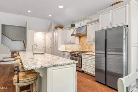 $975,000 | 212 Middlegreen Place, Holly Springs, NC 27540
