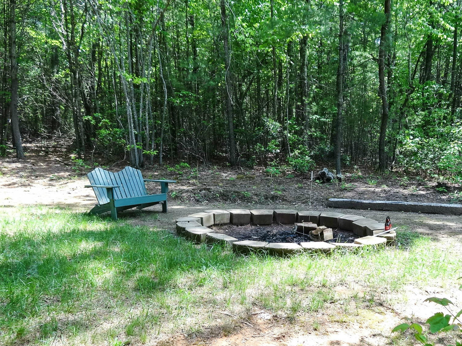 749 Isolane Road Callaway, VA 24067 - Photo 32 of 38 a backyard of a house with large trees and barbeque oven