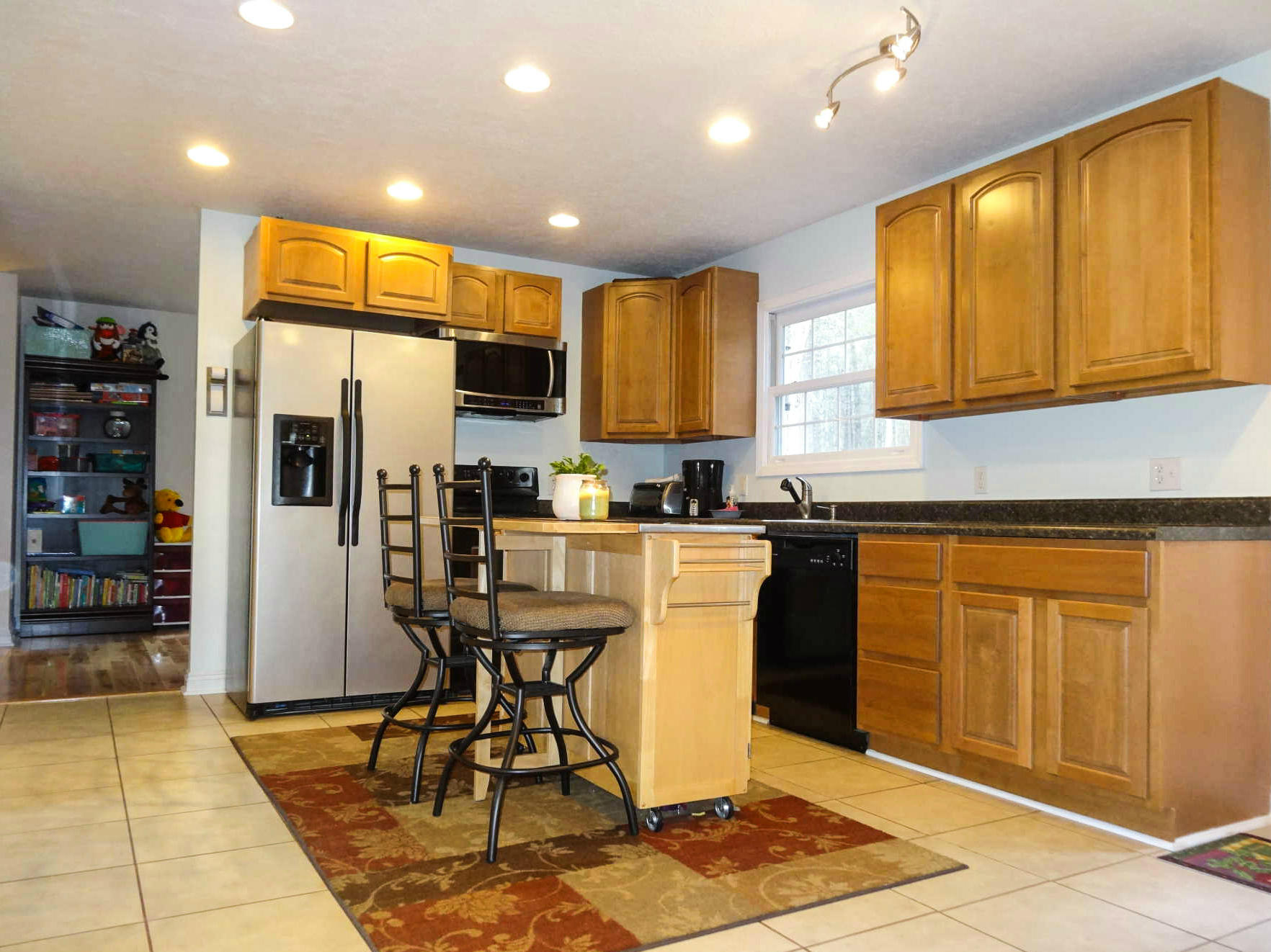749 Isolane Road Callaway, VA 24067 - Photo 7 of 38 a kitchen with stainless steel appliances granite countertop a refrigerator and cabinets