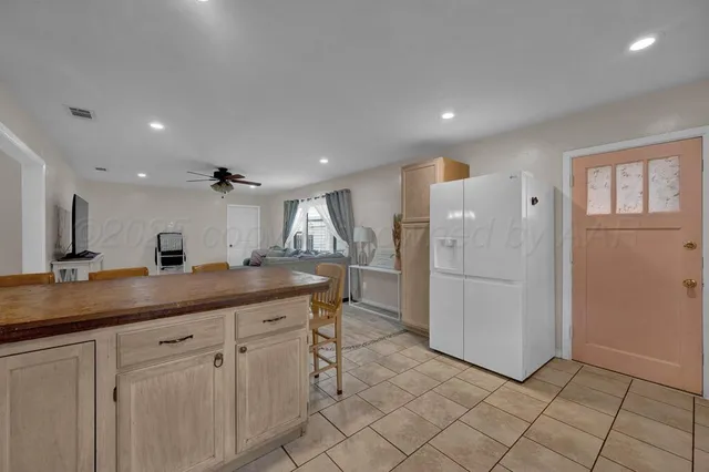 a kitchen with a sink and refrigerator