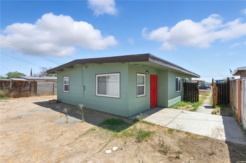 38833 9th Street East Palmdale, CA 93550 - Photo 24 of 28 a front view of a house with a yard