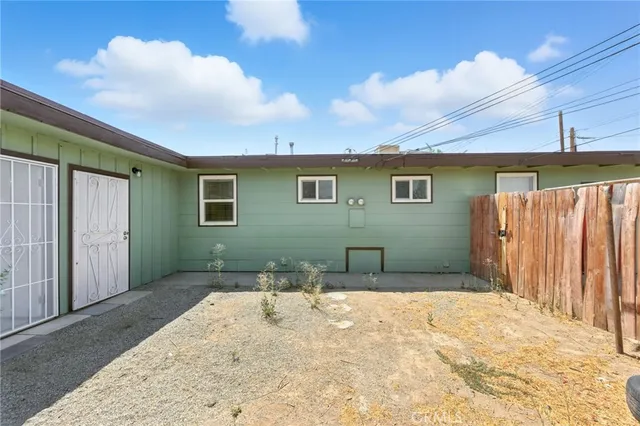 a view of backyard with tub