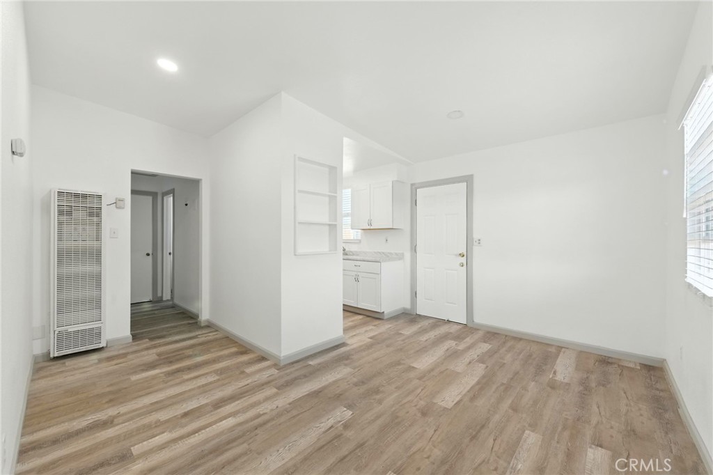 38833 9th Street East Palmdale, CA 93550 - Photo 5 of 28 a view of wooden floor and windows in a room