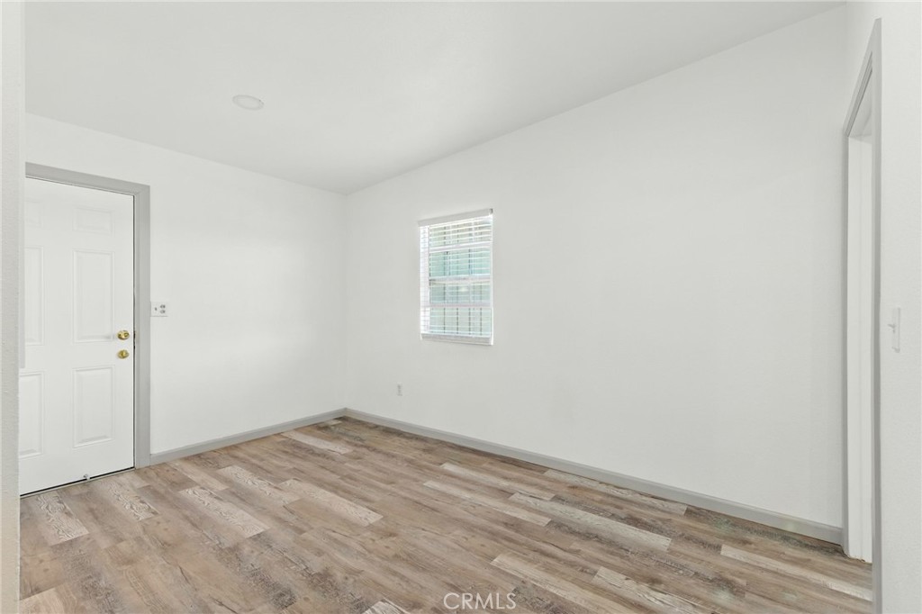 38833 9th Street East Palmdale, CA 93550 - Photo 10 of 28 wooden floor in an empty room