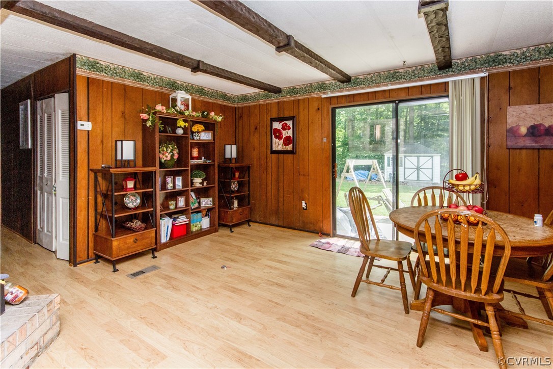 19059 Stokes Road Yale, VA 23897 - Photo 46 of 50 Dining area with exposed beams and wood stove/fire