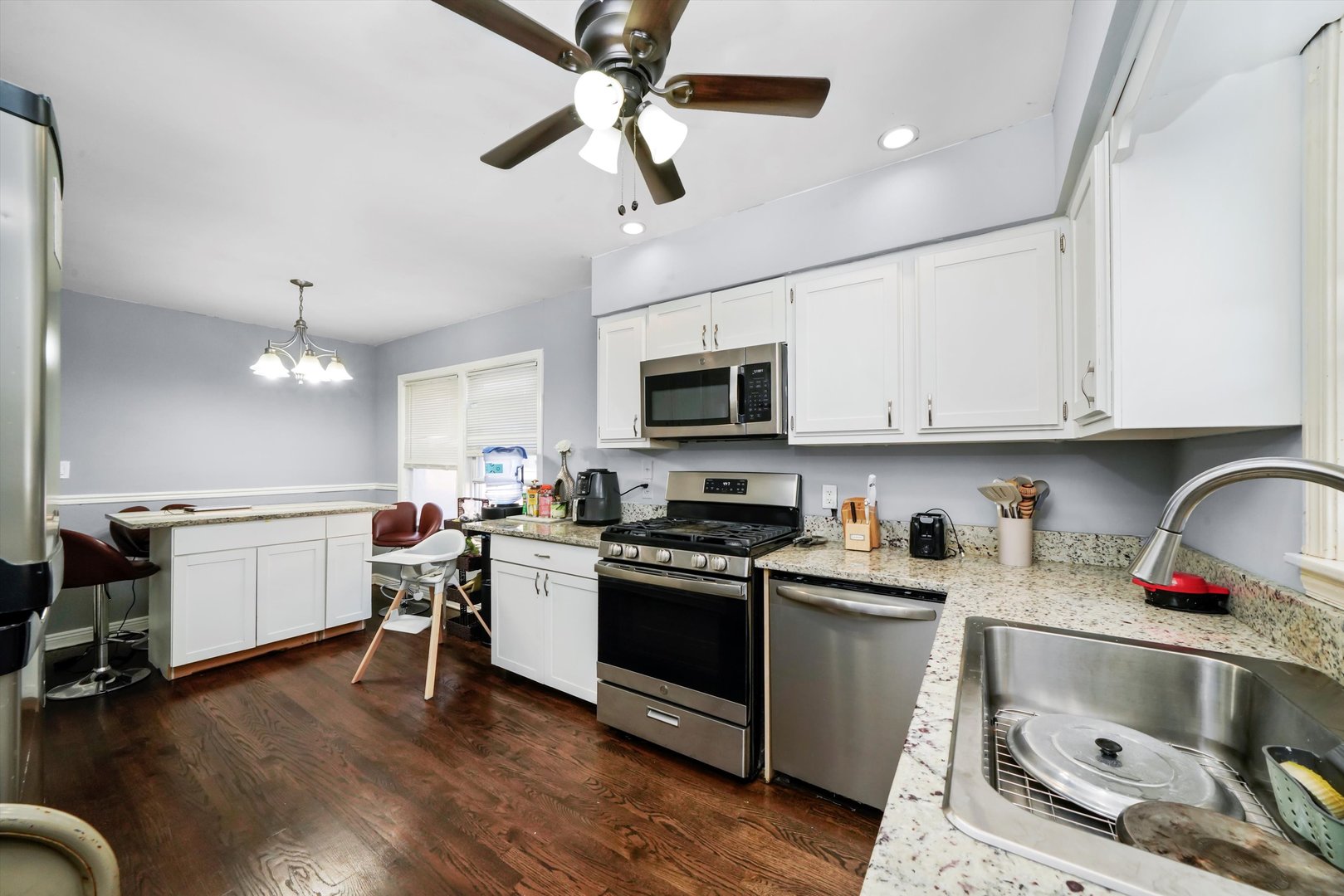3705 West 65th Place Chicago, IL 60629 - Photo 12 of 31 a kitchen with a sink appliances and cabinets