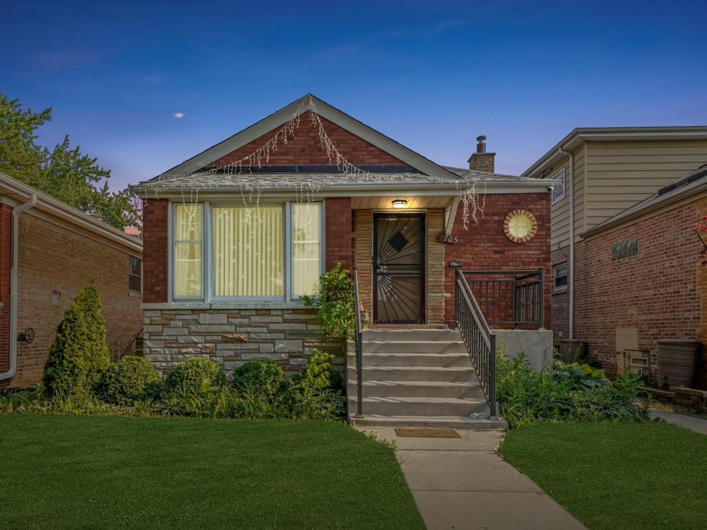 3705 West 65th Place Chicago, IL 60629 - Photo 2 of 31 a front view of a house with a yard