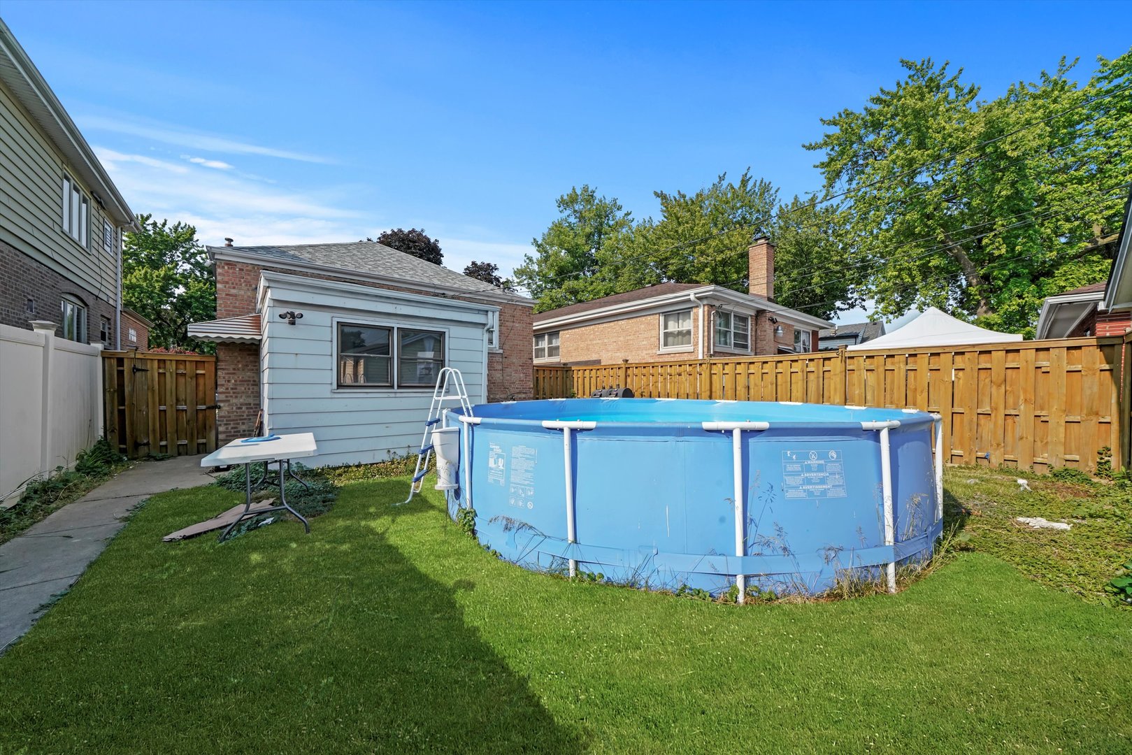 3705 West 65th Place Chicago, IL 60629 - Photo 21 of 31 a view of a house with backyard and sitting area