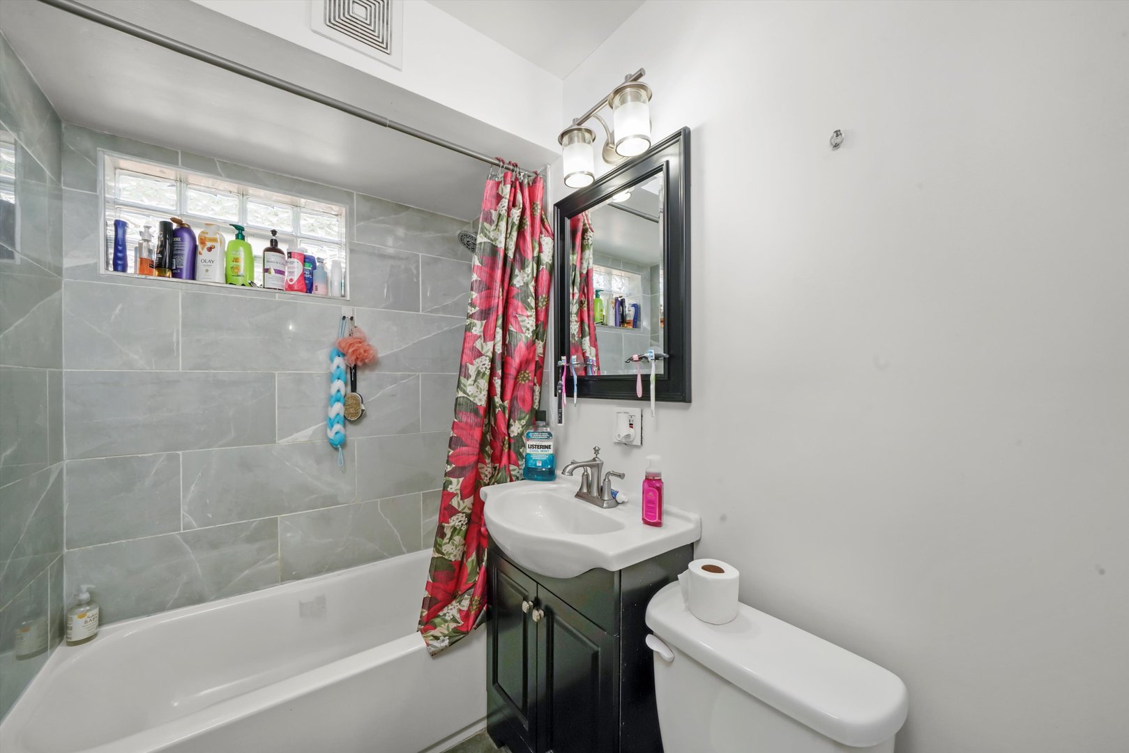 3705 West 65th Place Chicago, IL 60629 - Photo 6 of 31 a bathroom with a sink toilet and shower