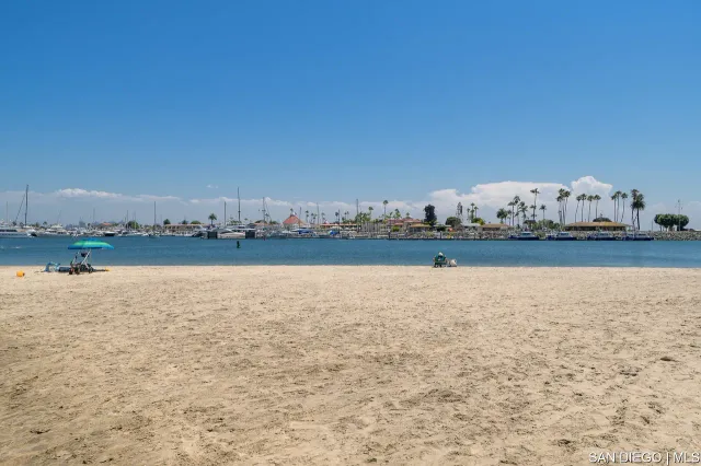 a view of a lake with couches in the background