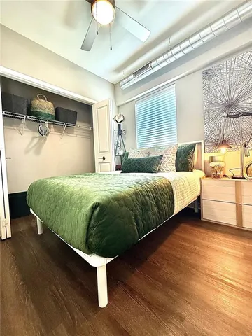 a bedroom with a bed and window
