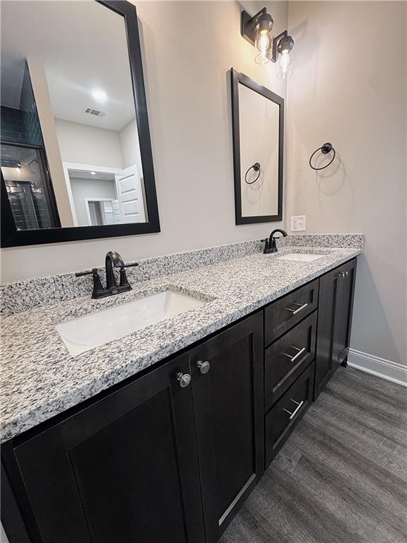7217 King Road Valley, AL 36854 - Photo 7 of 14 Bathroom featuring double vanity and dark wood-style flooring