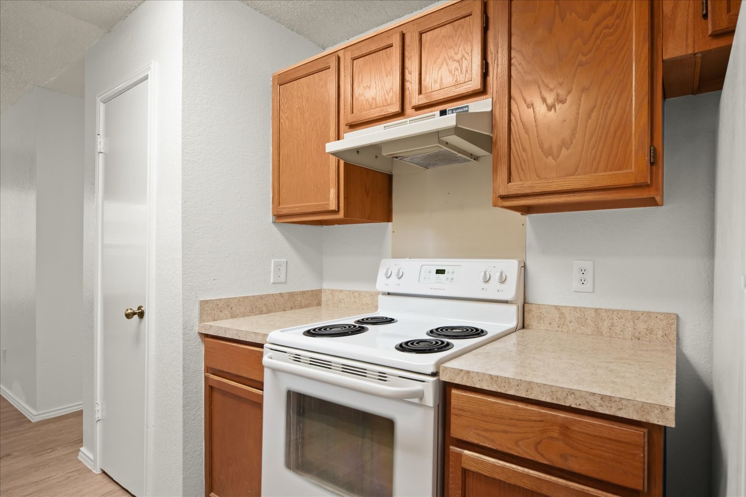 220 Sailmaster Street, Unit A Lakeway, TX 78734 - Photo 14 of 32 a kitchen with a stove and a microwave