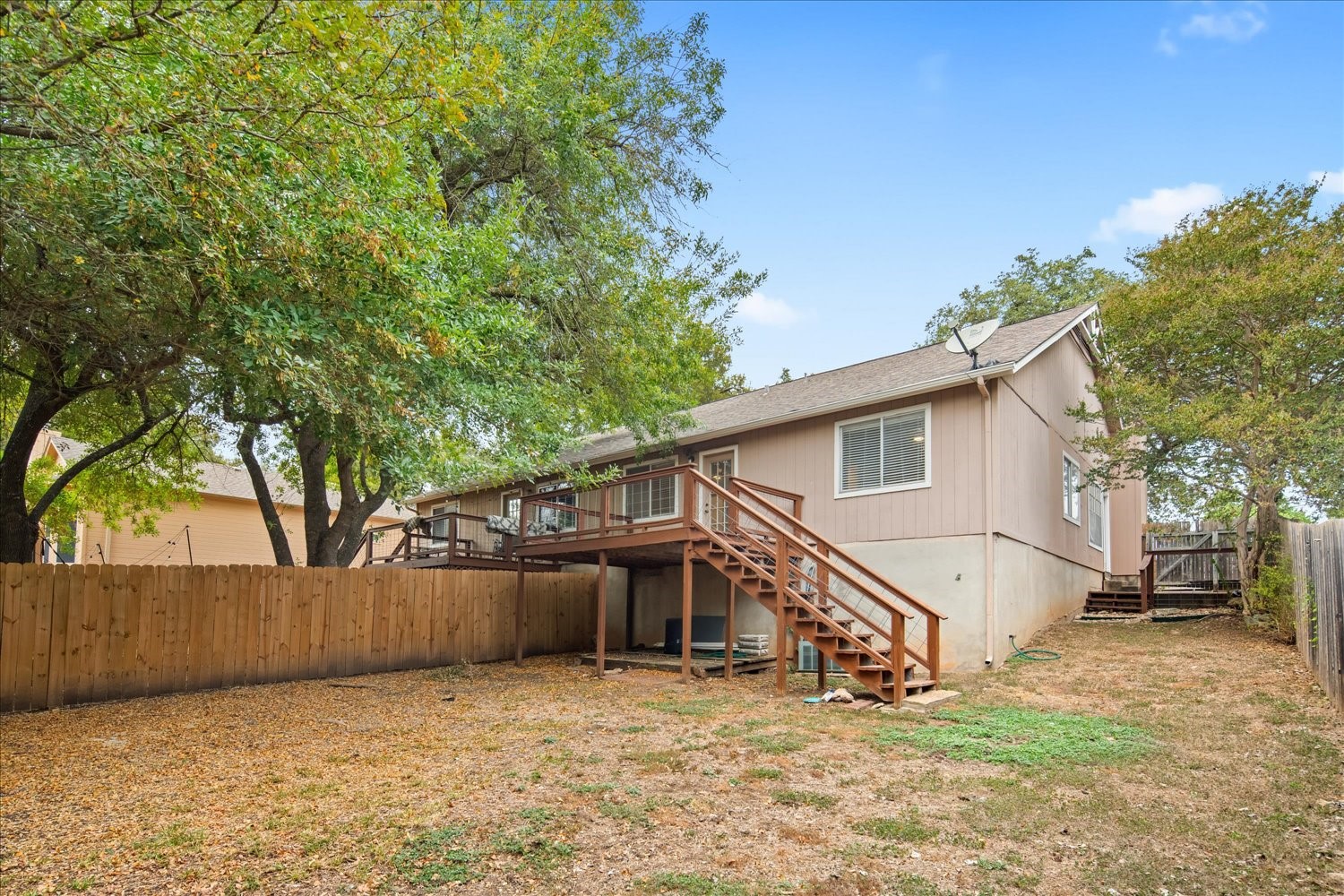 220 Sailmaster Street, Unit A Lakeway, TX 78734 - Photo 22 of 32 a view of a house with a yard