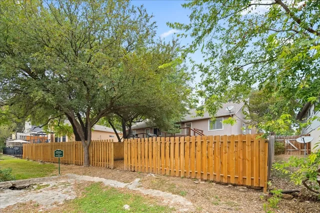 a view of a house with wooden deck