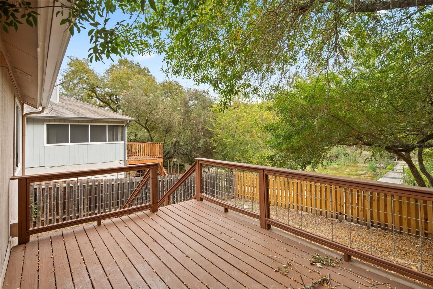 220 Sailmaster Street, Unit A Lakeway, TX 78734 - Photo 25 of 32 a view of a house with wooden deck