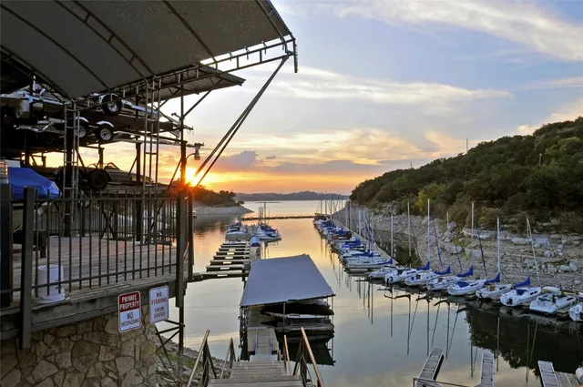 a view of a backyard with table and chairs
