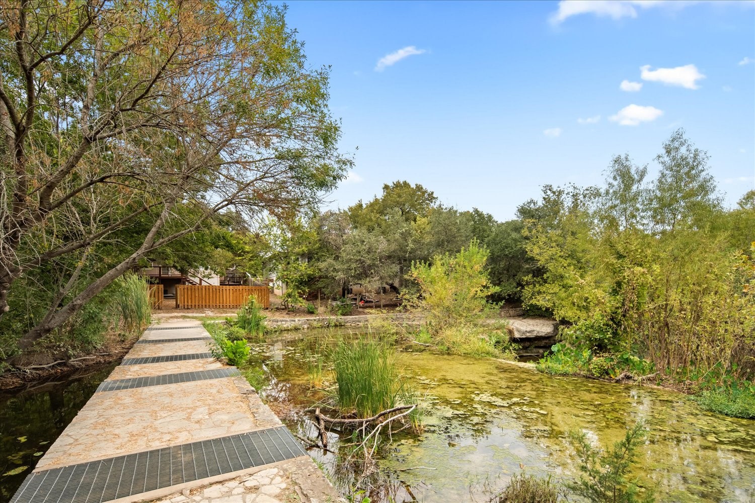 220 Sailmaster Street, Unit A Lakeway, TX 78734 - Photo 3 of 32 a pathway of a garden